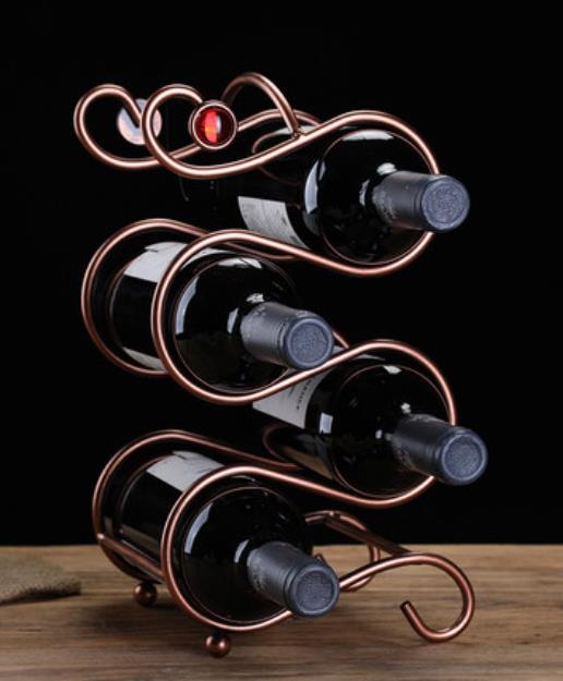 Metal jeweled wine rack display, holds 4 bottles