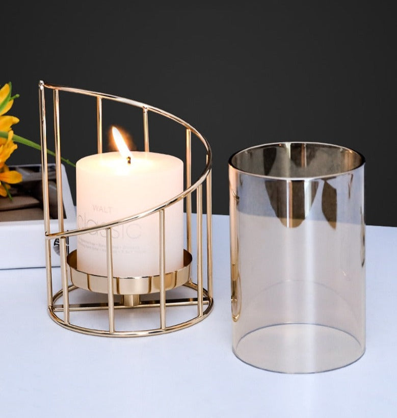 Gold colored metal candlestick holder with removable glass cover, doubles as flower vase 