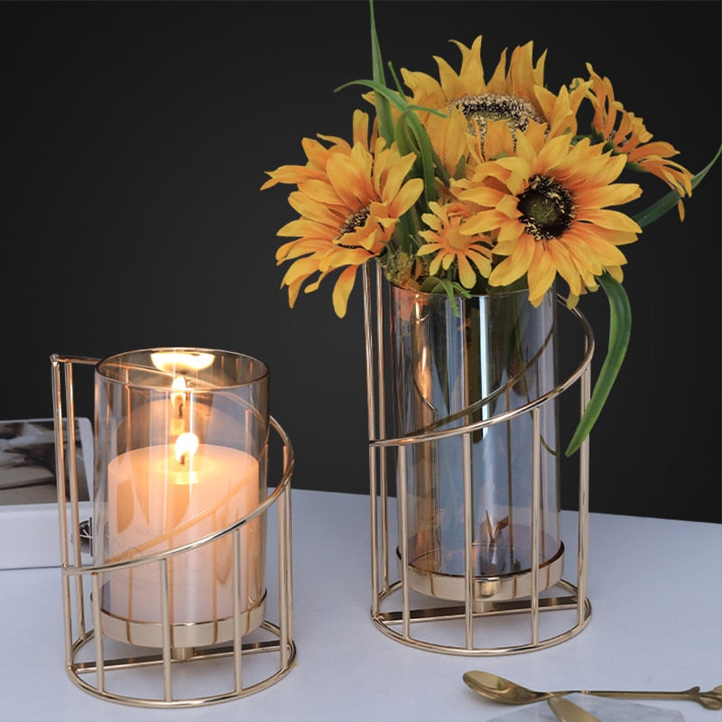 Gold colored metal candlestick holder with removable glass cover, doubles as flower vase 