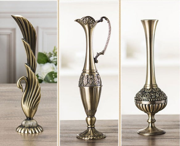 Assorted decorative metal vases. 