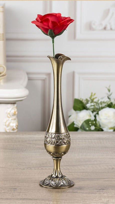 Metal vase with rose